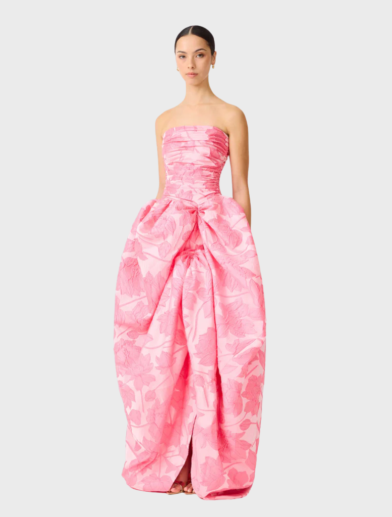 Strapless pink ball gown with a flattering silhouette and a full skirt, designed for glamorous occasions.