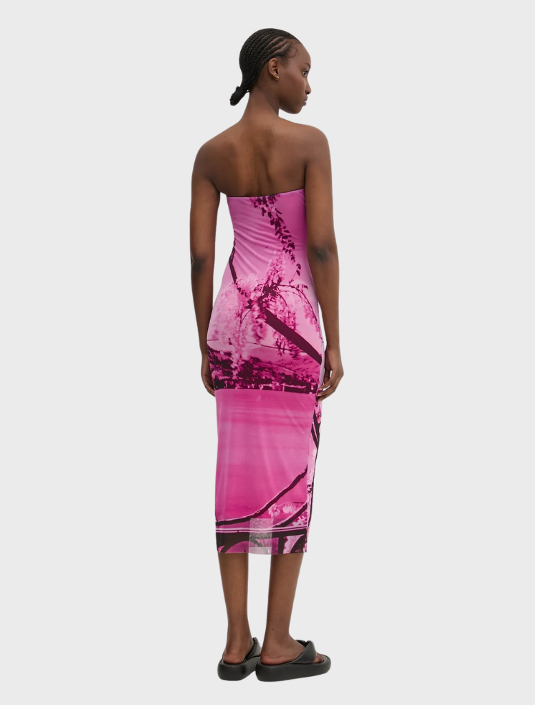 Close-up of a pink vest, highlighting its fabric and stitching details, perfect for adding a pop of color to any wardrobe.