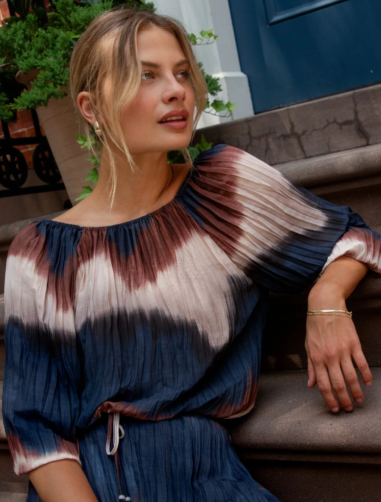 Pleated 3/4 bubble sleeve blouse featuring a vibrant Midnight Tides print in shades of blue and green.