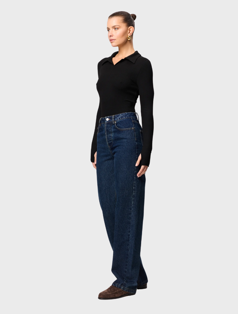 Sleek black polo top from Florence, combining comfort and style for a refined casual appearance.