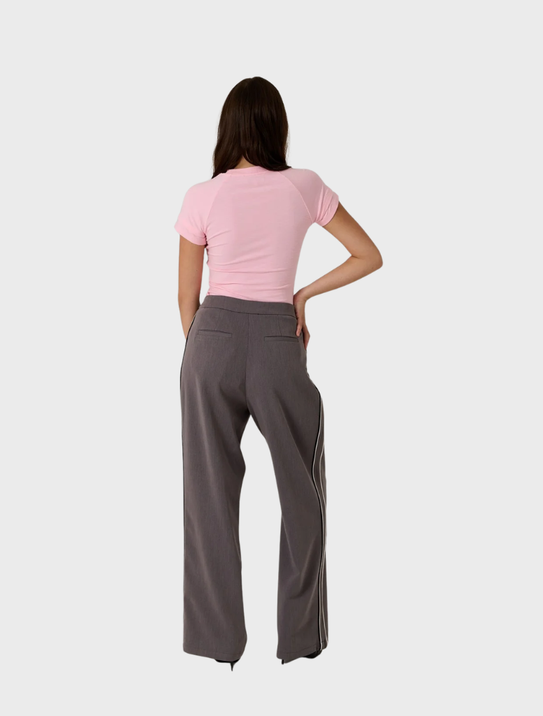 Zarah Baby Tee in vibrant pop pink, showcasing a comfortable fit and a chic style ideal for casual occasions.