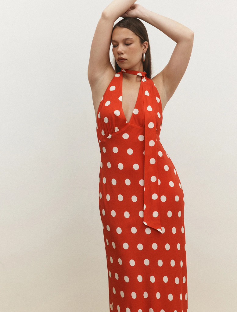 Elegant red maxi dress adorned with white polka dots, featuring a comfortable fit ideal for warm weather events.