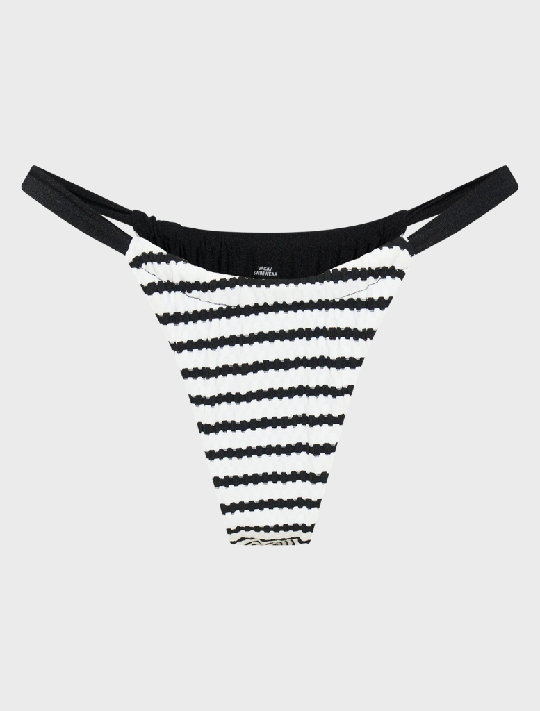 Rhodes Bottom - Selene, showcasing a serene landscape with lush greenery and a tranquil water body under a clear sky.