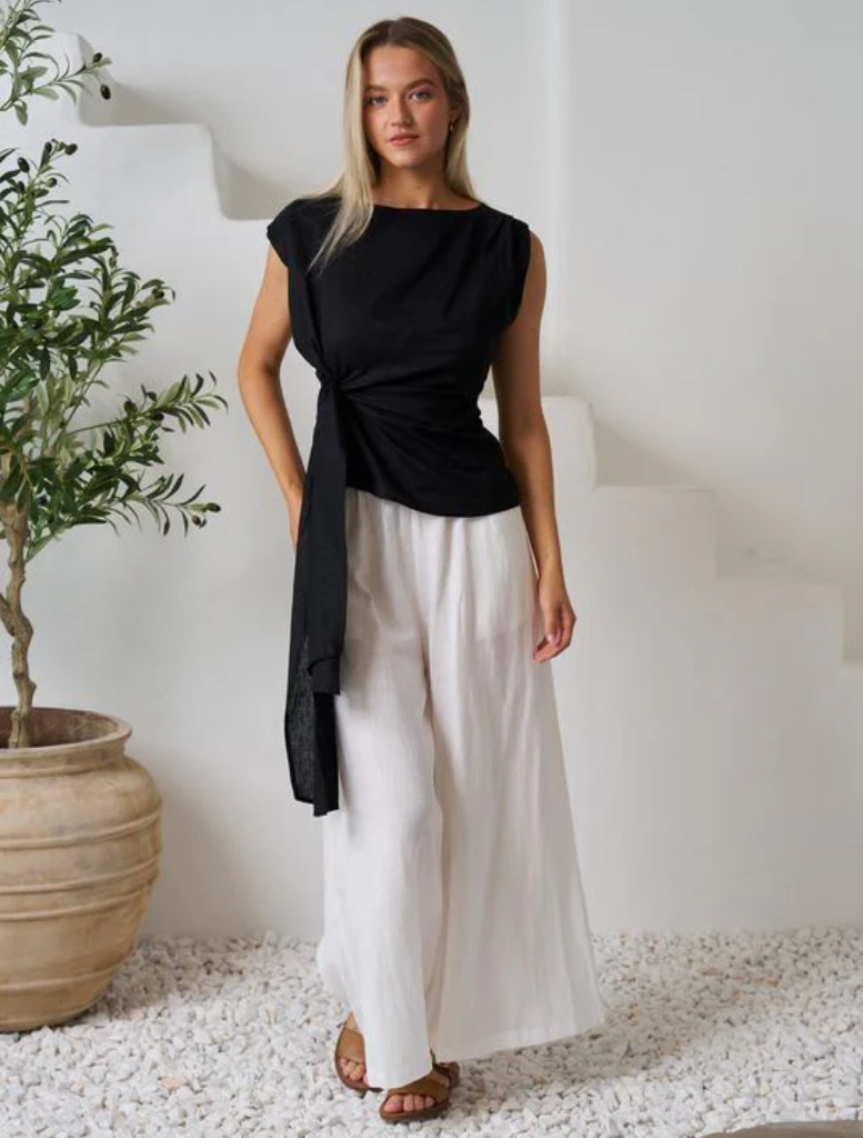 Black Rihanna top featuring a sleek design, perfect for casual or dressy occasions.