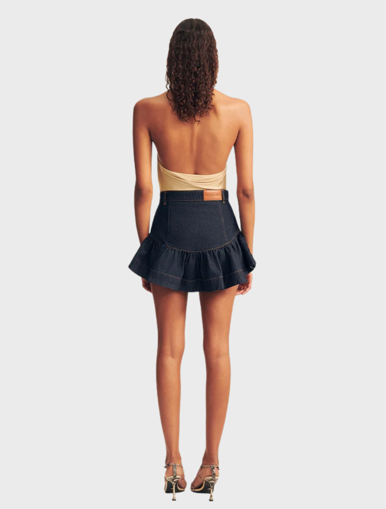Deep indigo mini skirt with elegant ruffles, combining comfort and style for versatile fashion choices.