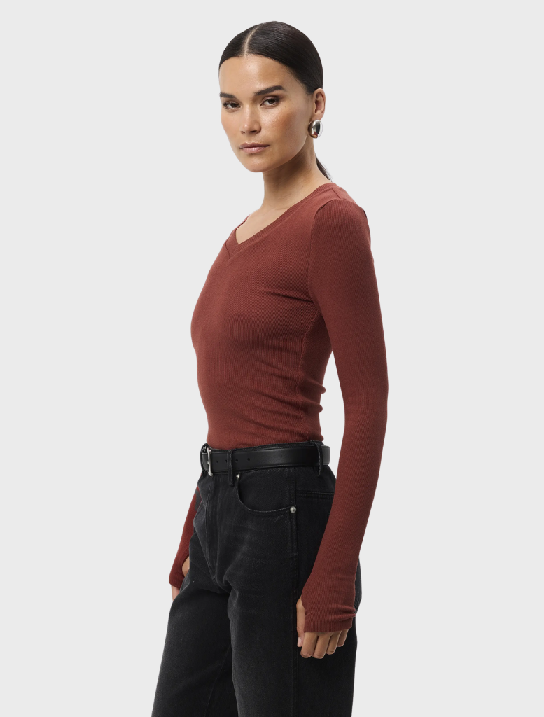 Rust Sedona Top laid flat, highlighting its comfortable fit and short sleeves, ideal for casual wear.
