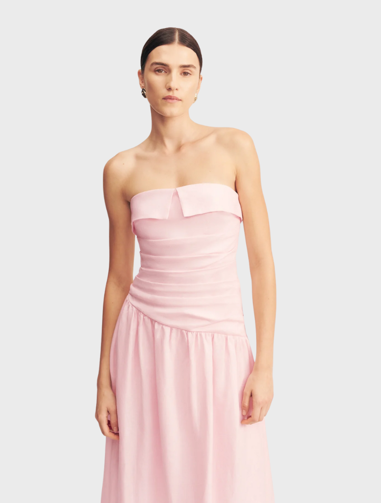 Gigi Strapless Maxi Dress, adorned with a Sakura floral pattern, showcasing a chic and elegant design perfect for warm weather.