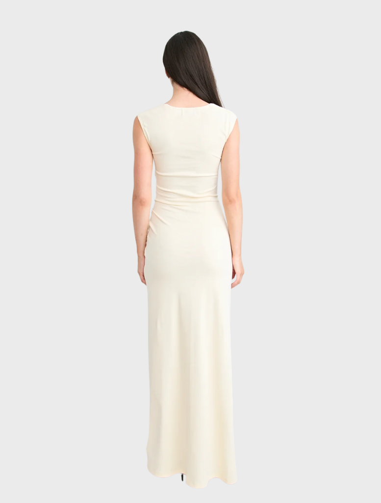 Beautiful butter Samara gown, featuring a refined silhouette and gentle draping, perfect for evening wear or formal gatherings.