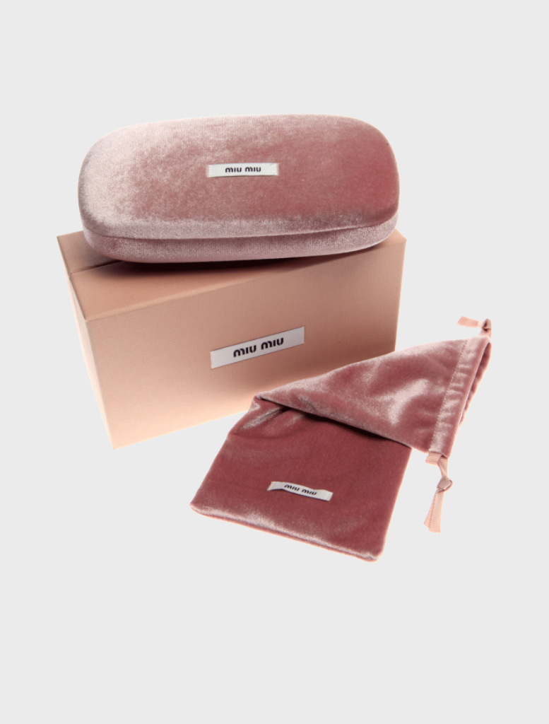 A pink velvet box containing silver sunglasses with ivory mirror lenses, elegantly displayed inside.