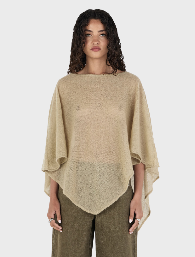 Simona Poncho in pistachio green, featuring a stylish design suitable for various occasions.