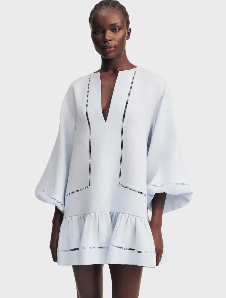 Elegant sky blue mini dress with balloon sleeves, designed by Tommy, ideal for summer events and stylish gatherings.