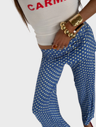 A gold bracelet featuring a prominent large ball as its centerpiece.