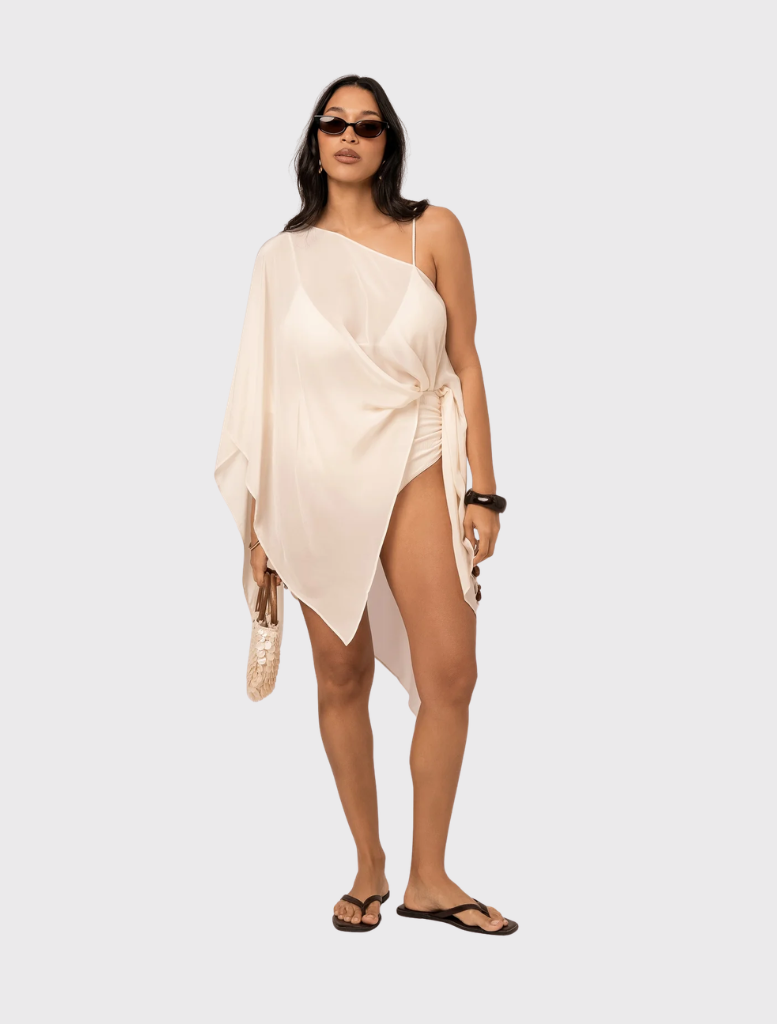 Sola Resort Cape in Honeymoon: sheer layer with bateau neckline, cascading points, warm champagne hue, versatile styling options.