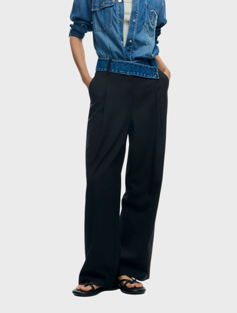 A pair of solid long trousers, designed with a classic fit, ideal for versatile styling in various settings.