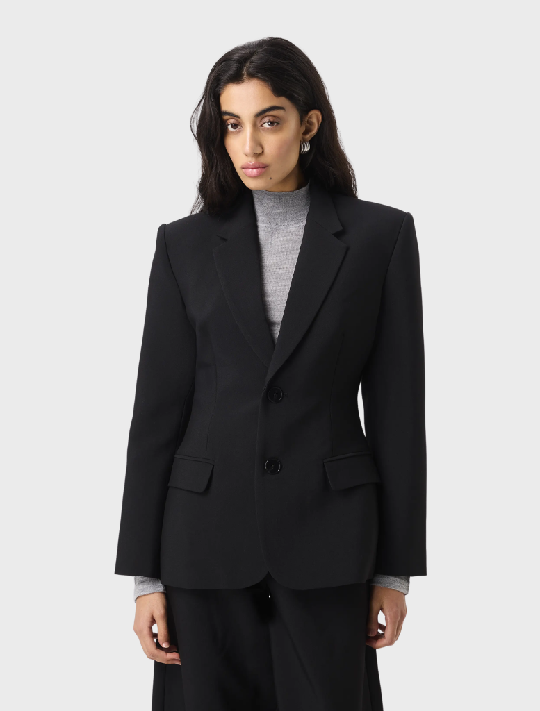 Black Sonder Blazer displayed on a hanger, featuring a tailored fit and sleek design suitable for formal occasions.