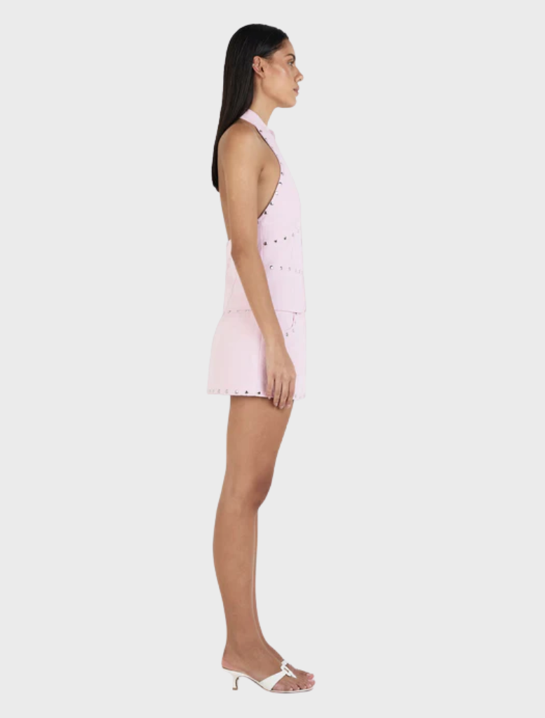 Baby pink skort by Nikita, featuring studded details for a contemporary and stylish outfit.