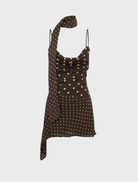 Stylish Alora scoop neck mini dress in chocolate and lemon polka dots, suitable for warm weather events and gatherings.