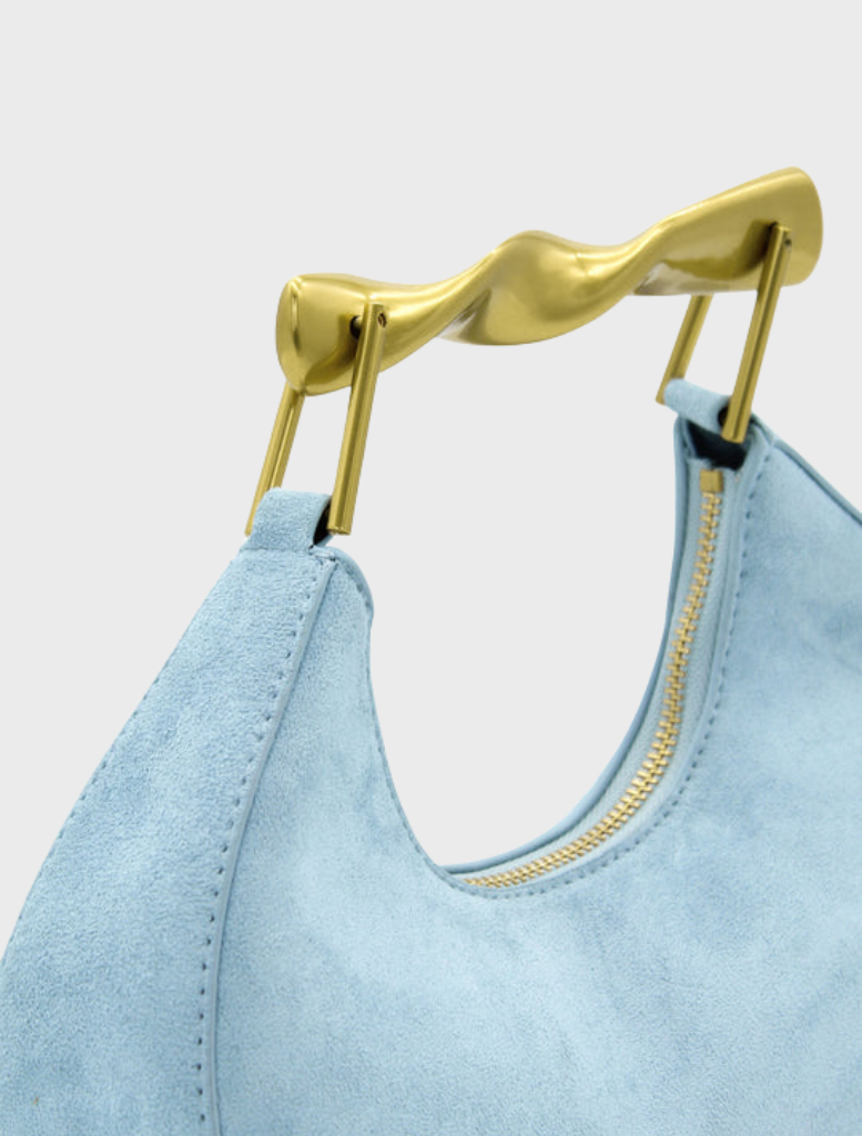 Stylish pale blue Myla handbag, showcasing a modern silhouette and refined detailing for a chic look.