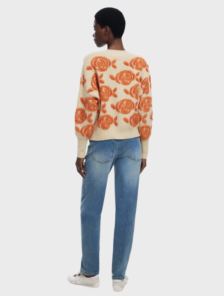 Stylish thick gauge jacket with a bold floral pattern, offering both warmth and a trendy look for colder seasons.