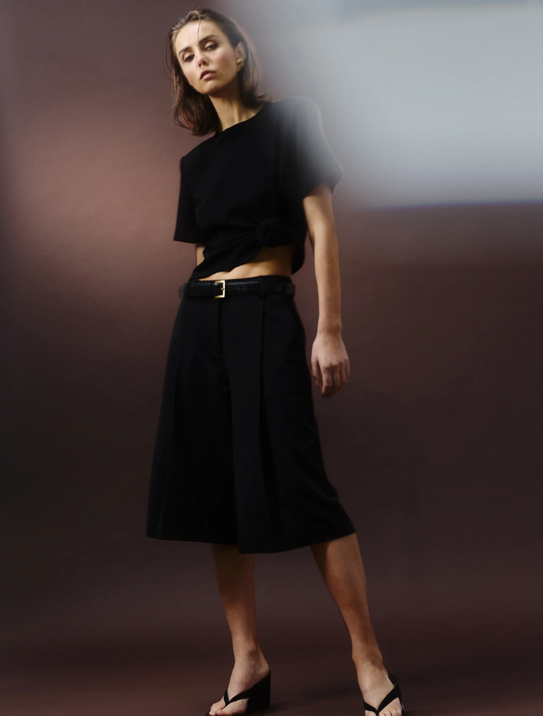 Elegant black Tied & True Top with a versatile style suitable for various outfits and events.