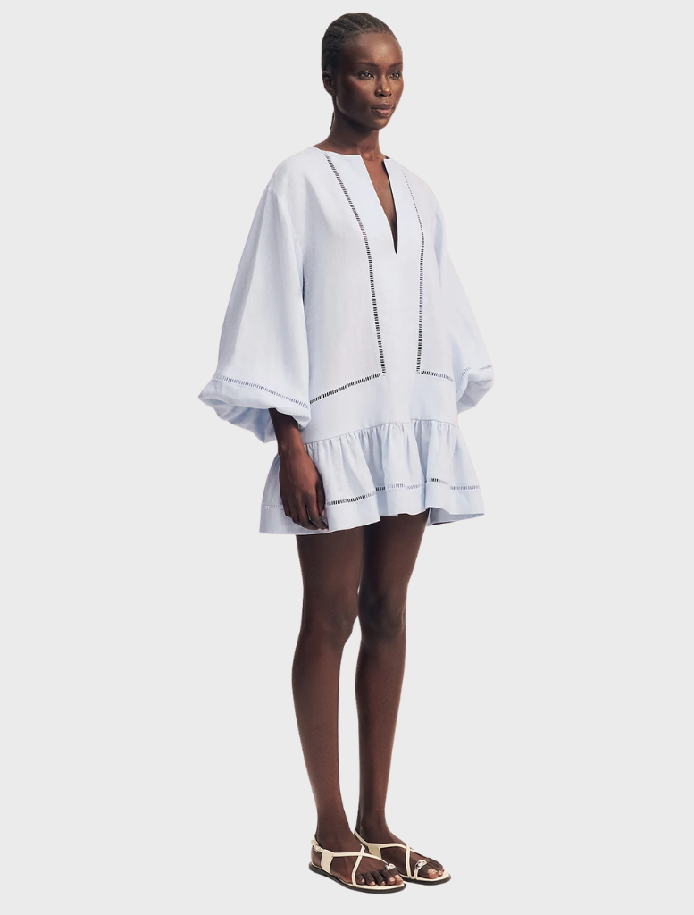Tommy's sky blue mini dress with balloon sleeves, combining comfort and style for a chic, casual look.