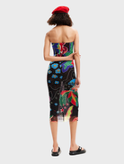 Neutral grey Swim Jungle Dress laid flat, highlighting its soft fabric and playful jungle-inspired patterns.