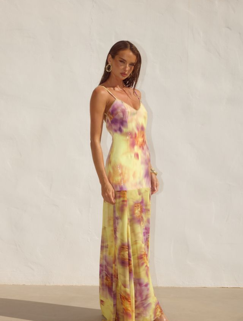 Elegant Tulia Low Back Maxi Dress in Suri Yellow, designed with a flattering fit and a chic low back for a trendy appearance.