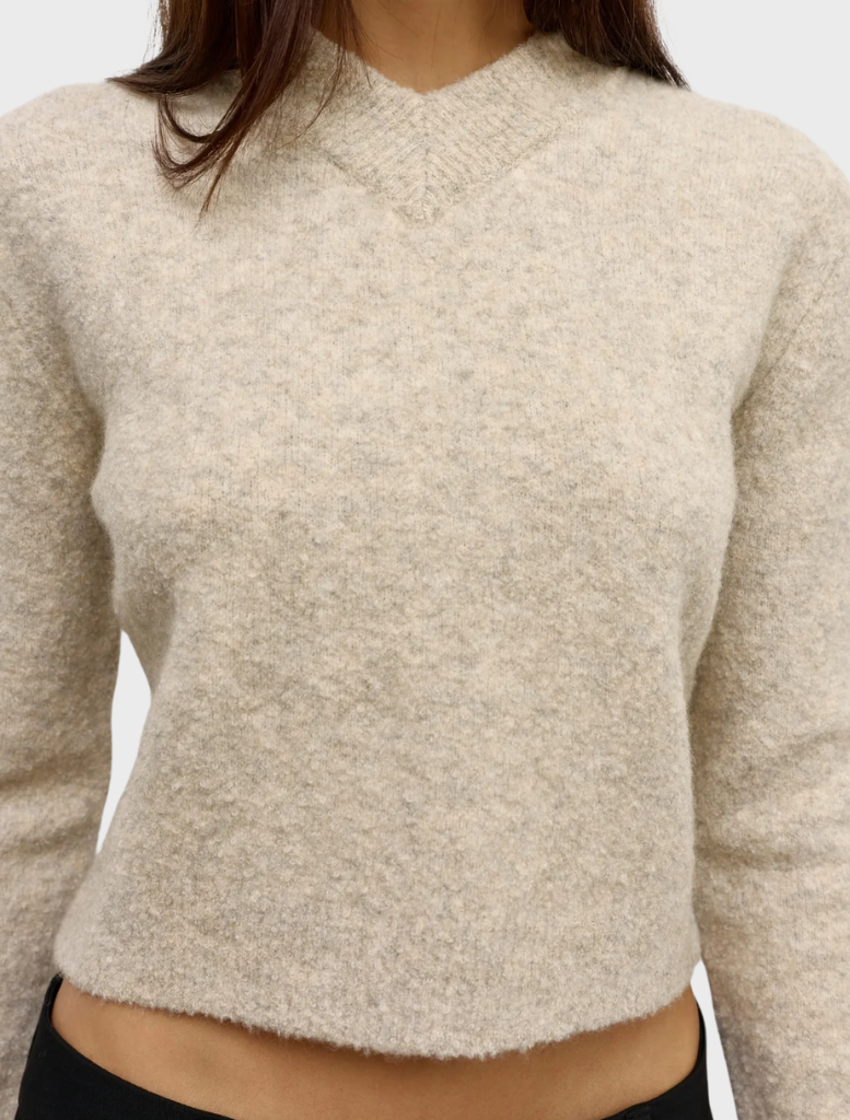 A detailed view of the Claudia V Knit in Urchin, highlighting its soft texture and stylish silhouette.