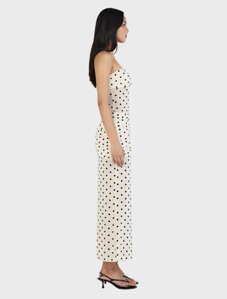 Cream-colored maxi dress with a playful polka dot design, perfect for summer outings or special occasions.