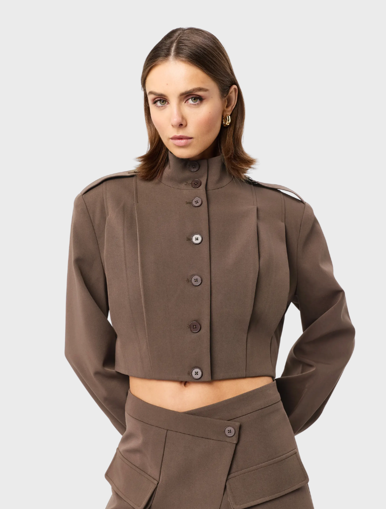 Mocha-colored Vault Bomber jacket displayed on a hanger against a neutral background.