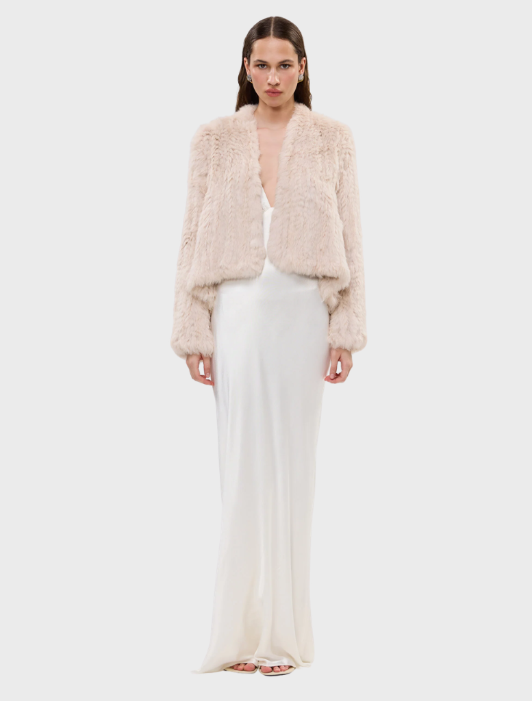 Emma Jacket in stone, made from up-cycled rabbit fur, features an open front and a stylish short-to-long design.