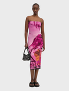 Pink vest displayed against a neutral background, showcasing a stylish design suitable for casual wear.