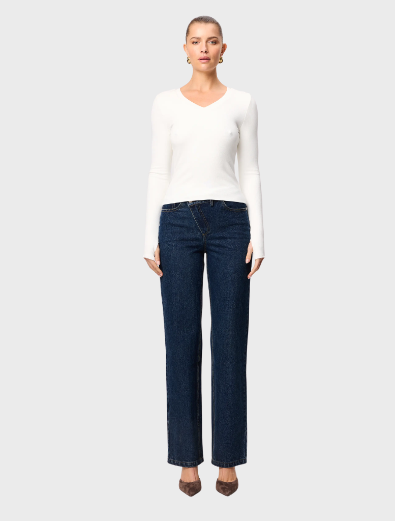 White Sedona top on a hanger, highlighting its clean lines and breathable material for everyday comfort.