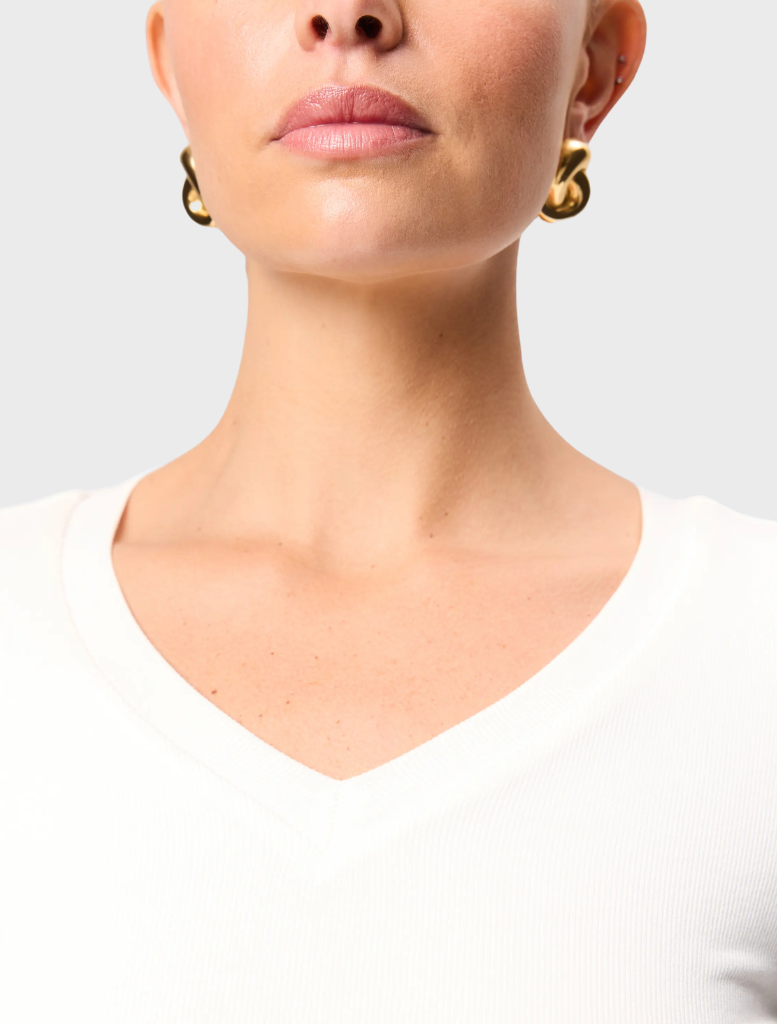 White Sedona top featuring a relaxed fit and short sleeves, perfect for casual or semi-formal occasions.