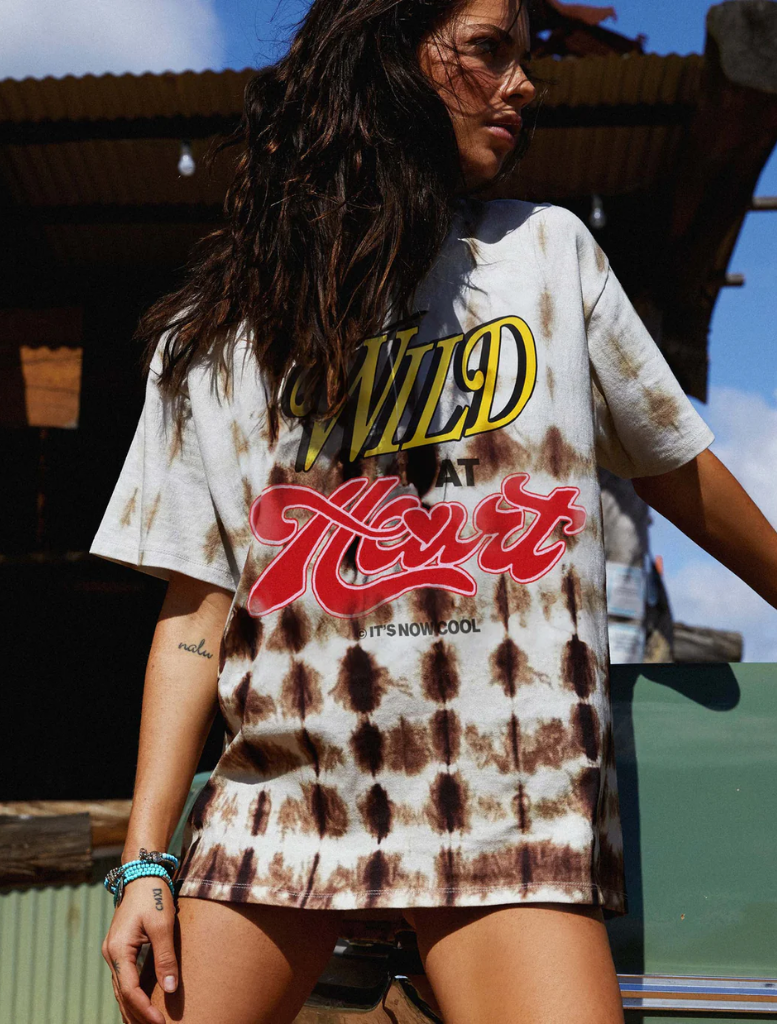 A trendy Signature Tee adorned with a bold Wild Hearts print, suitable for casual occasions and personal expression.