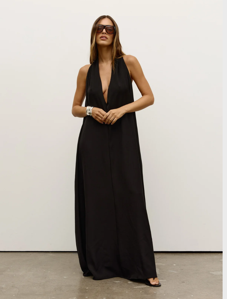 Black Willow dress displayed on a mannequin, featuring a flowing silhouette and elegant design suitable for various occasions.