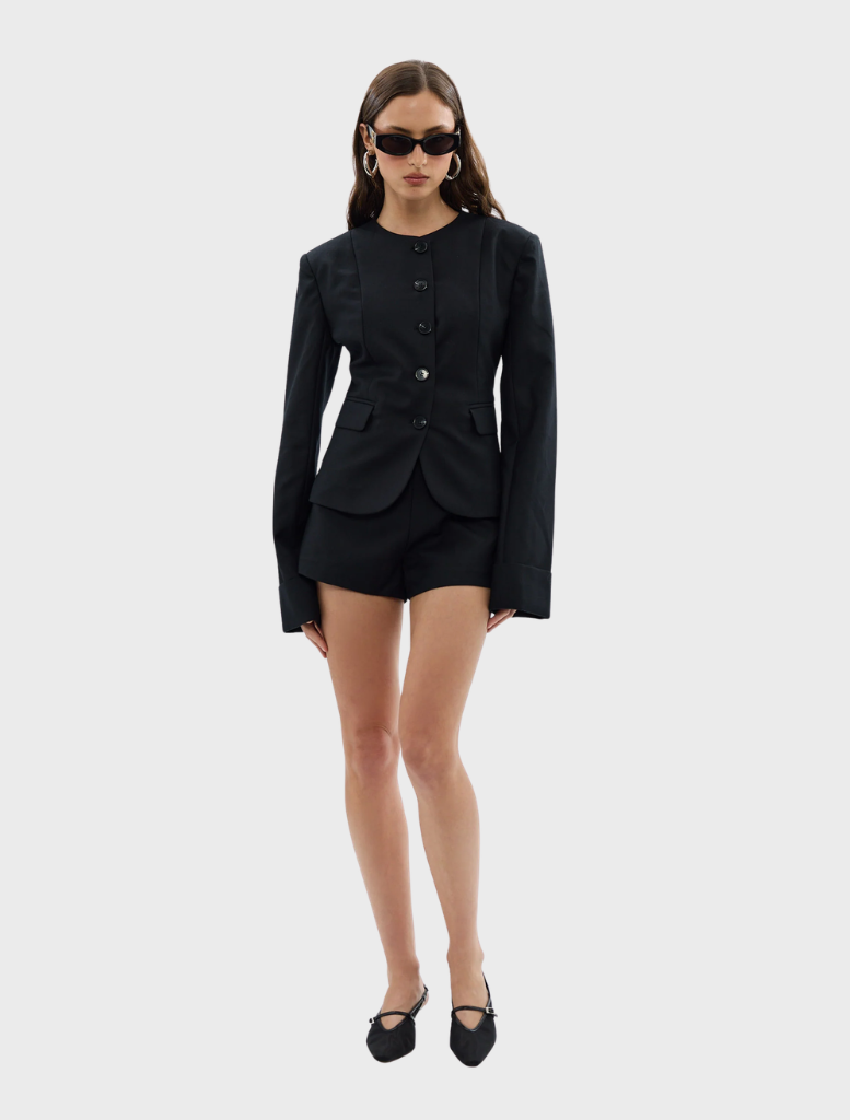 Black Alba Jacket on a mannequin, illustrating its fit and contemporary style.