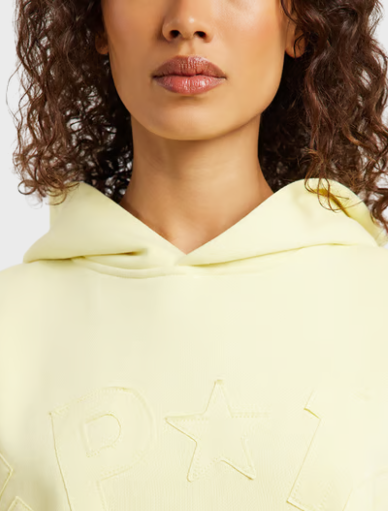 Celestial yellow hoodie featuring an oversized fit, brushed fleece fabric, and ribbed details, ideal for casual wear.