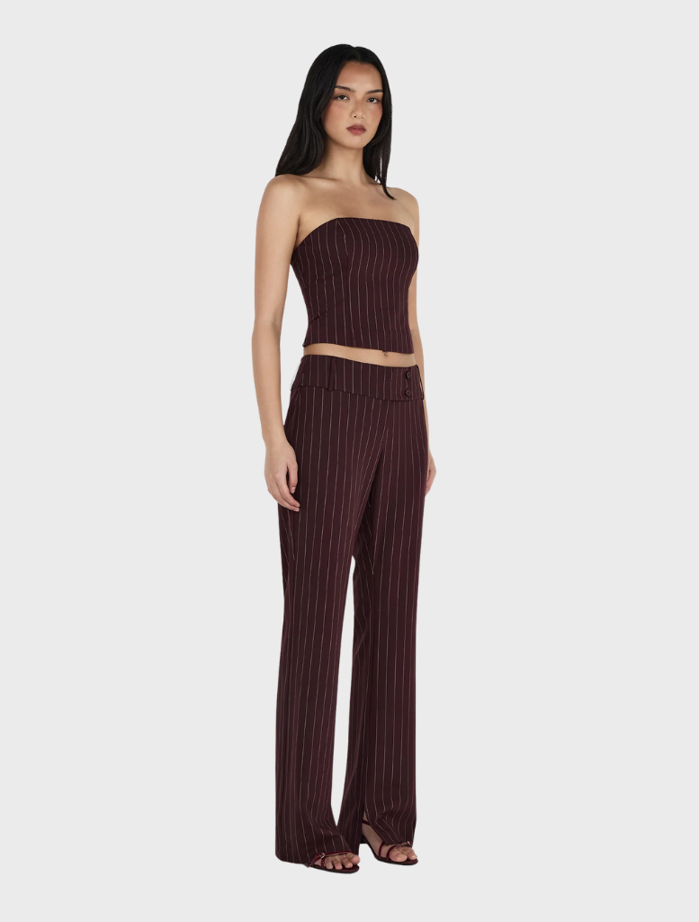 Model wears a burgundy striped top and wide-leg pants, showcasing the Yolanda Suit Pant in Cherry Choc Stripe design.