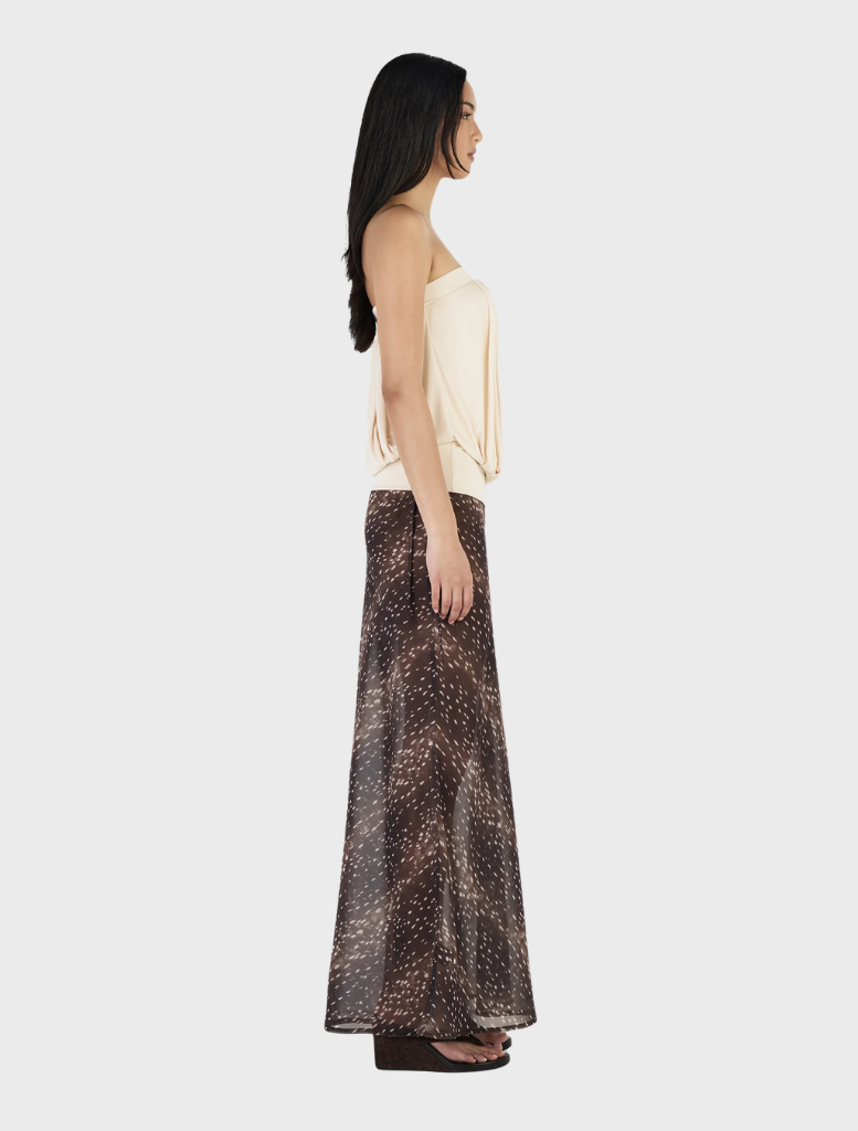 ZOE top in cream color, presented on a hanger, highlighting its sleek design and soft material.