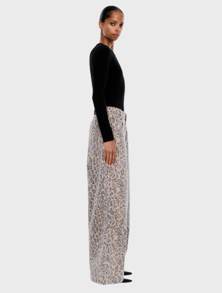 Close-up of Wynn Animal Jean in leopard print, highlighting the fabric texture and bold animal pattern.
