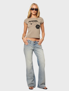 Y2K Baby Tee in olive color, designed with a nostalgic print, suitable for casual and stylish looks.