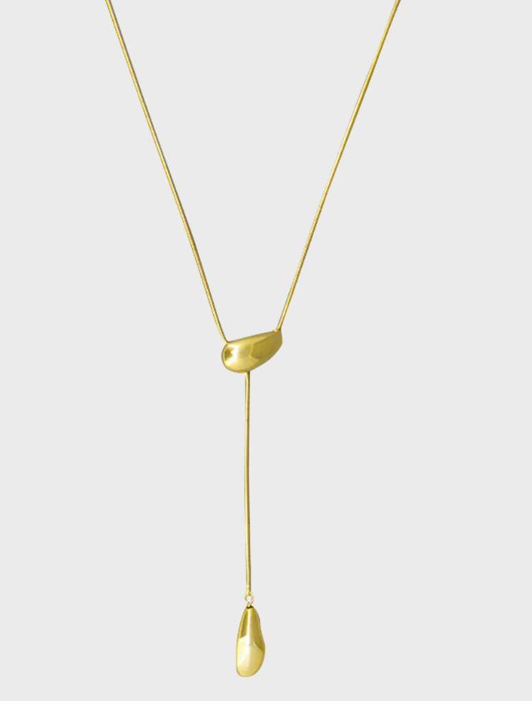 Gold Yunna necklace displayed on a white background, featuring an elegant design with intricate detailing.