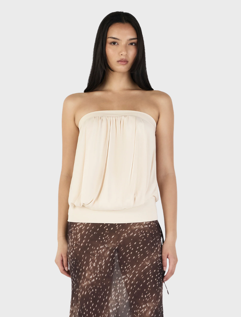 Zoe top in cream color, featuring a stylish design suitable for casual or formal occasions.
