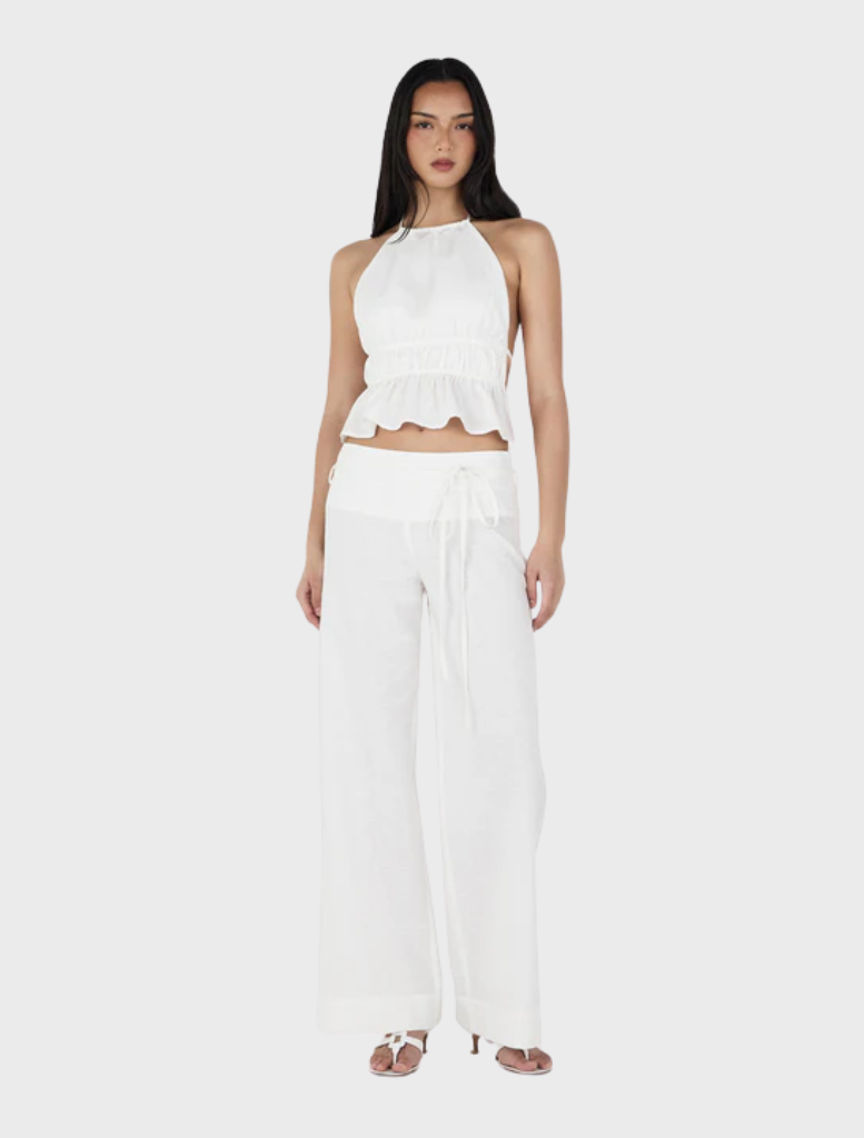 Ivory Zuri Halter Top, showcasing a modern silhouette ideal for summer outings or evening events.