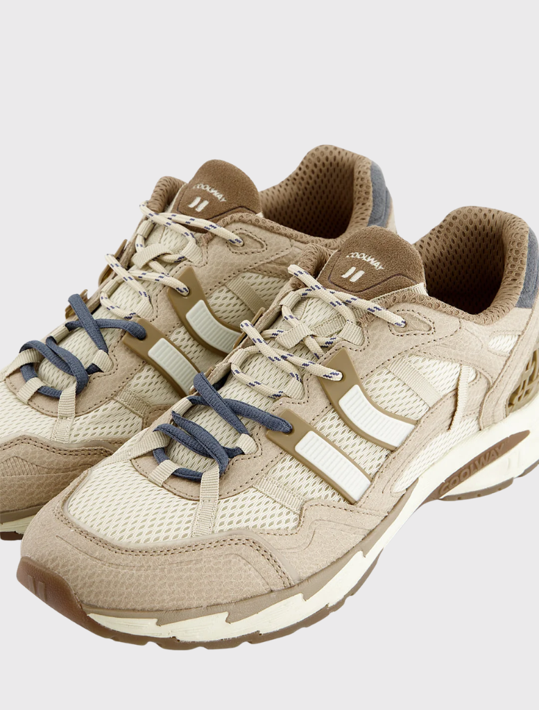Stylish running sneaker with a breathable mesh upper, suede accents, and a durable rubber outsole for stability and grip.

