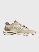 Vintage-inspired retro running sneaker featuring a breathable mesh upper and suede panels for added texture and style.

