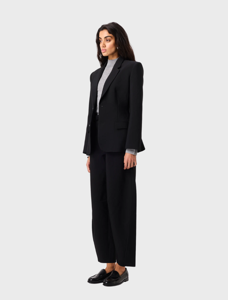 Black Sonder Blazer displayed on a hanger, featuring a tailored fit and sleek design suitable for formal occasions.