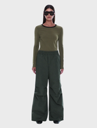 Olive check wide-leg pull-on pant with elastic waistband and adjustable drawcord hems for a relaxed fit and contemporary style.