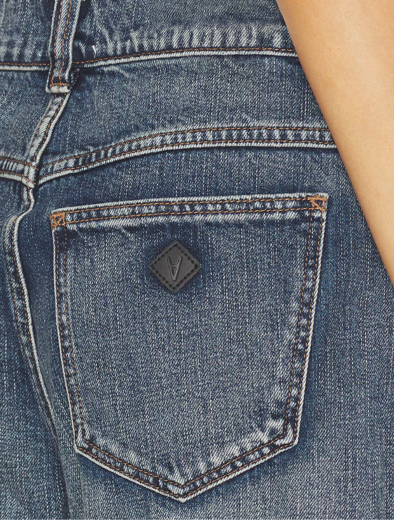 The 95 Super Baggy jeans laid flat, showcasing their unique design and spacious cut against a neutral background.